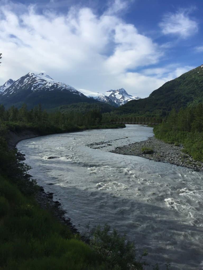 glacier with mountains around it