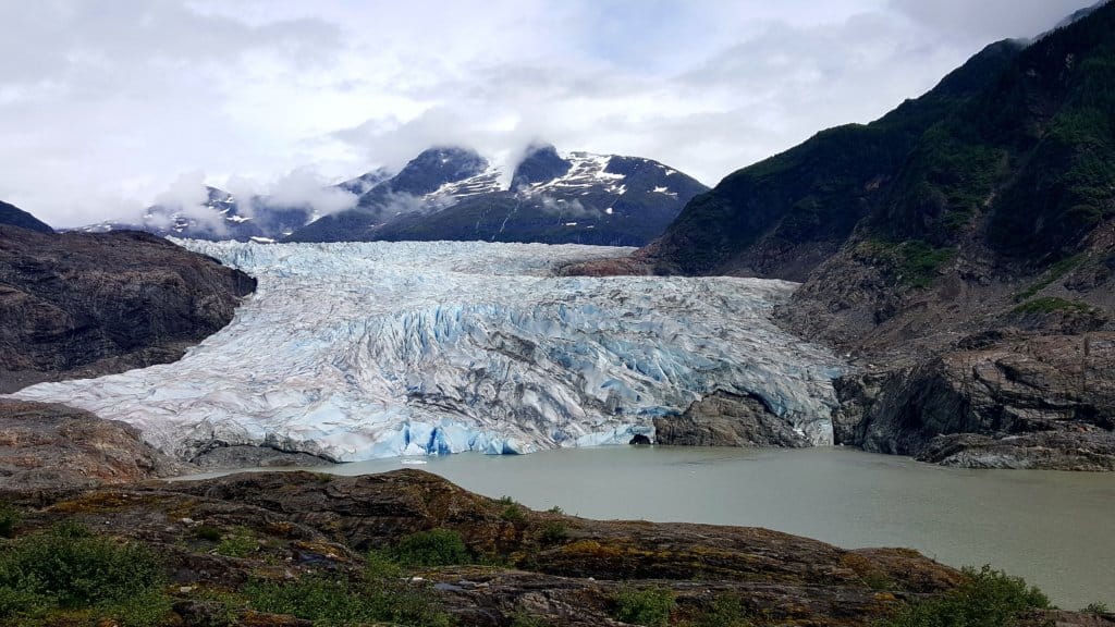 a tidewater glacier with ocean in the foreground