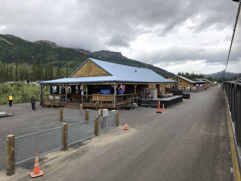 Rustic train station with mountains in background