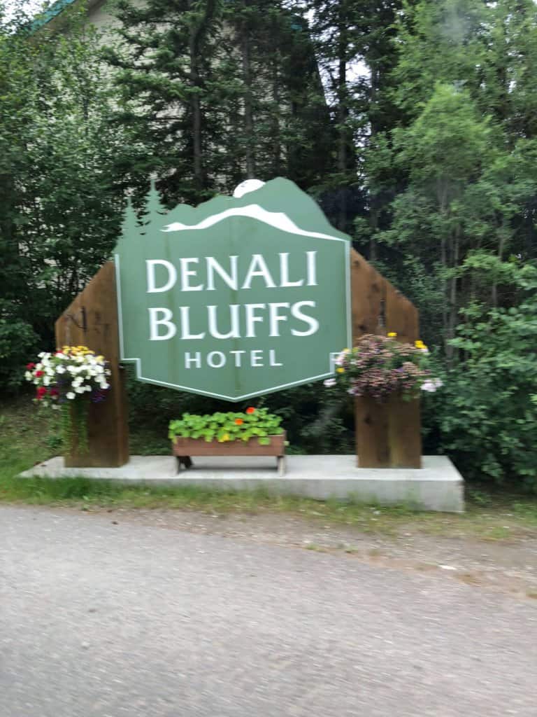 Sign reading Denali Bluffs Hotel