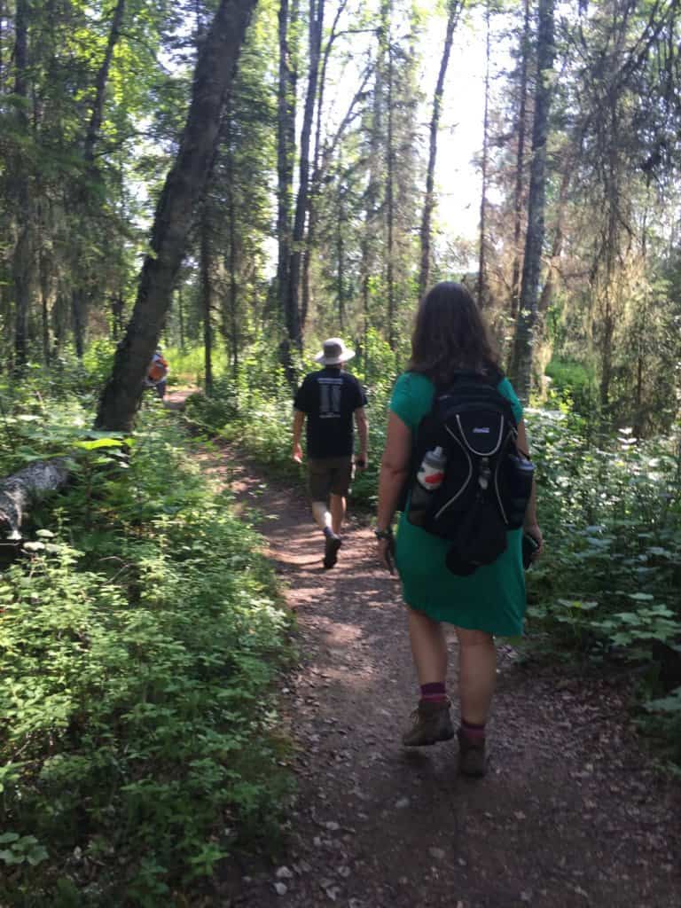 Husband and wife walking along a trail