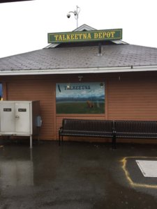 Outside train station with sign Talkeetna Depot