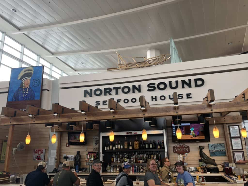 3 females and 1 male sitting at a restaurant bar Norton Sound