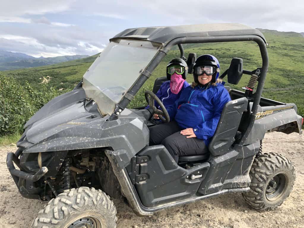 Mother and daugher sitting in an ATV