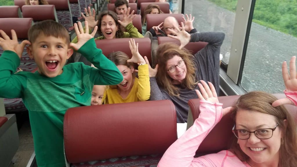 3 women and 2 kids pretending to have moose antlers