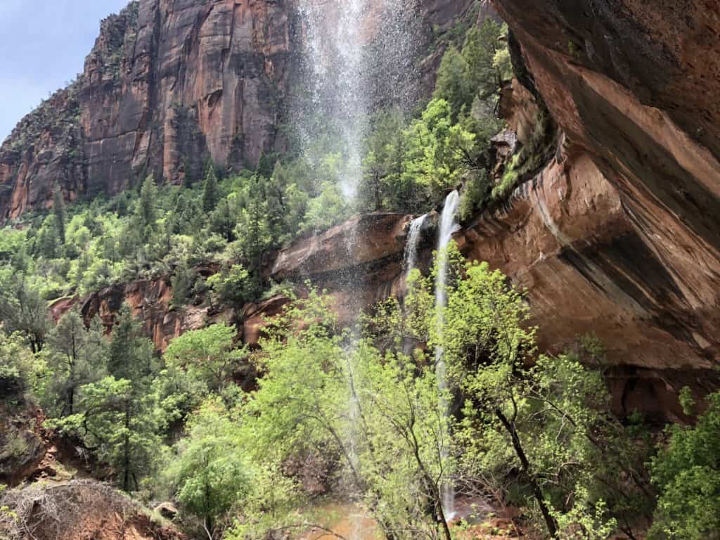 waterfalls inside a red rock canyon