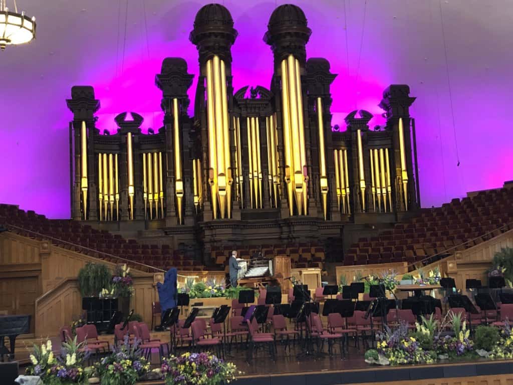 large organ with purple lights in the background