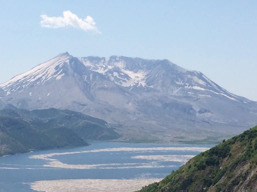 ocean with big mountain in the background