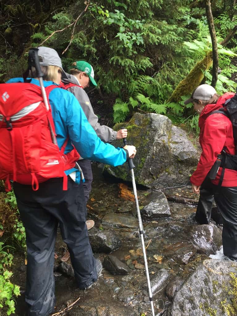 Hiking in Alaska crossing stream