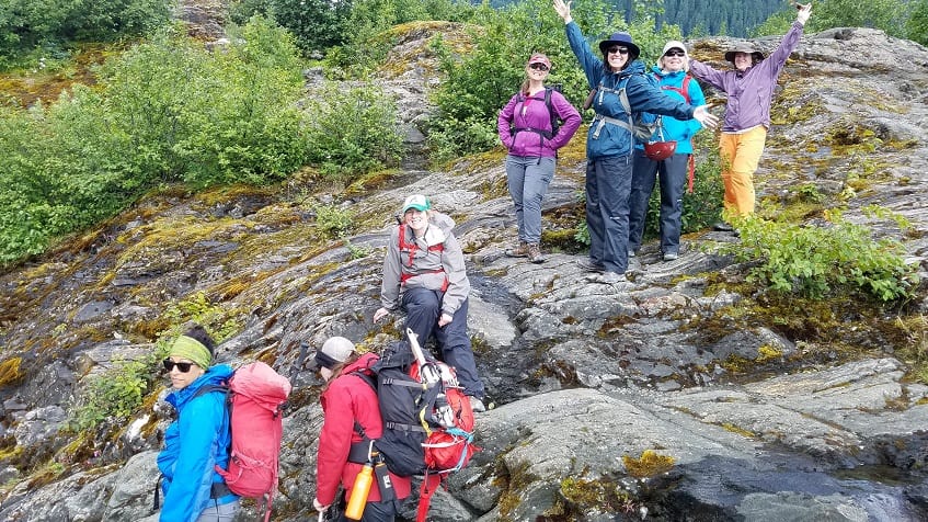 Celebration at the top of rock scramble