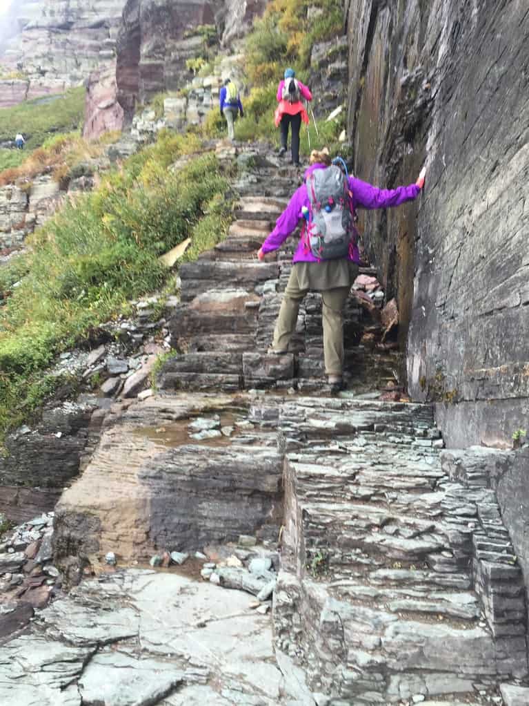 climbing stone steps on hiking path at Glacier National Park